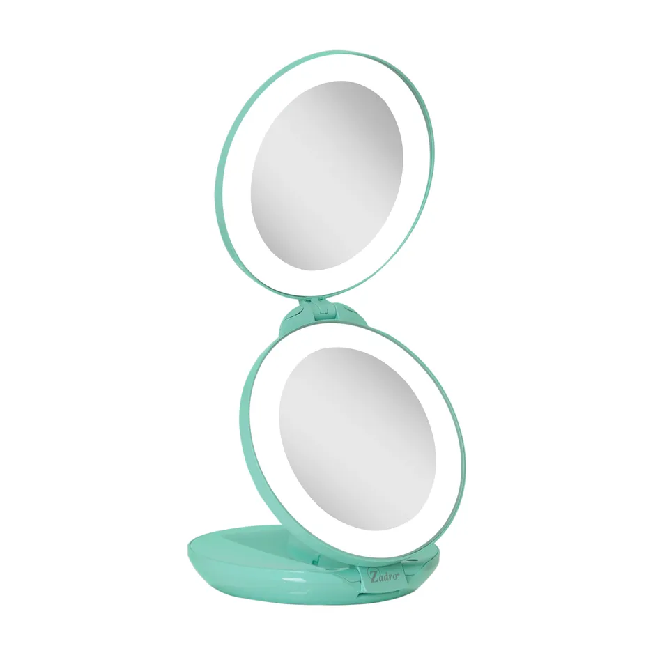 zadro-espejo-de-viaje-plegable-iluminado-led-con-aumento-10x-1x image 1