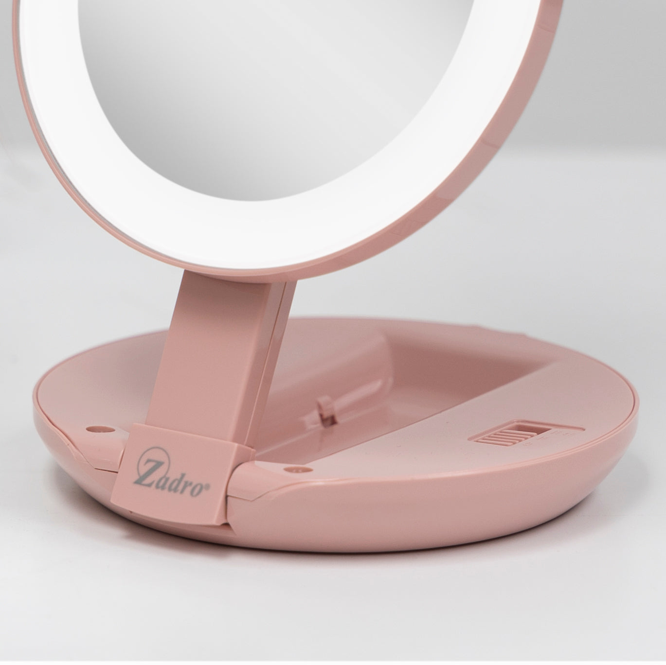 zadro-espejo-de-viaje-plegable-iluminado-led-con-aumento-10x-1x image 6